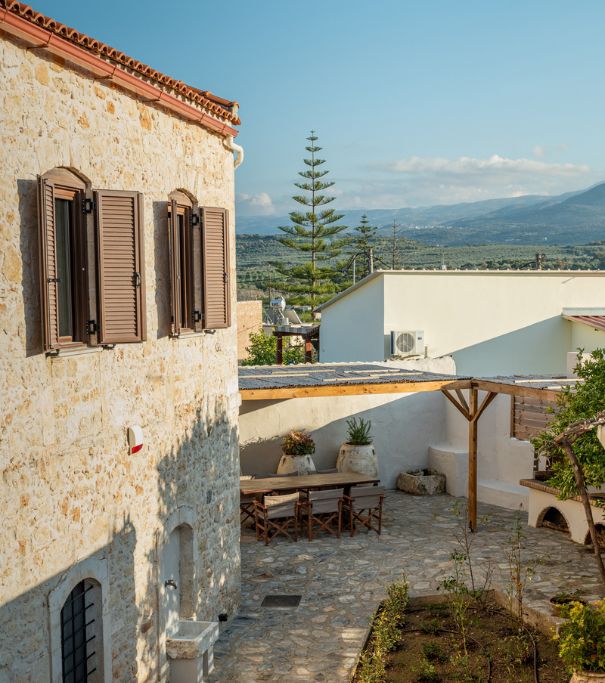 View of Antama traditional stone house and Melidoni village in Crete